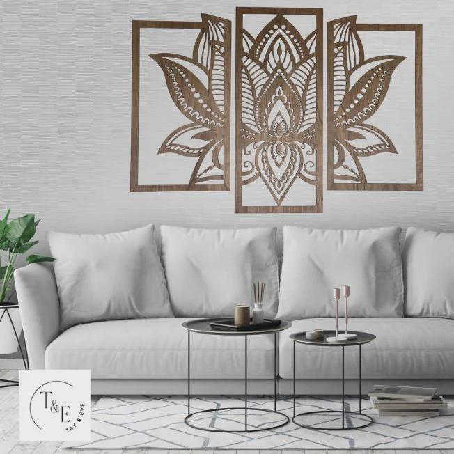 Decorative wall art mandala lotus flower pattern above a sofa in a living room.