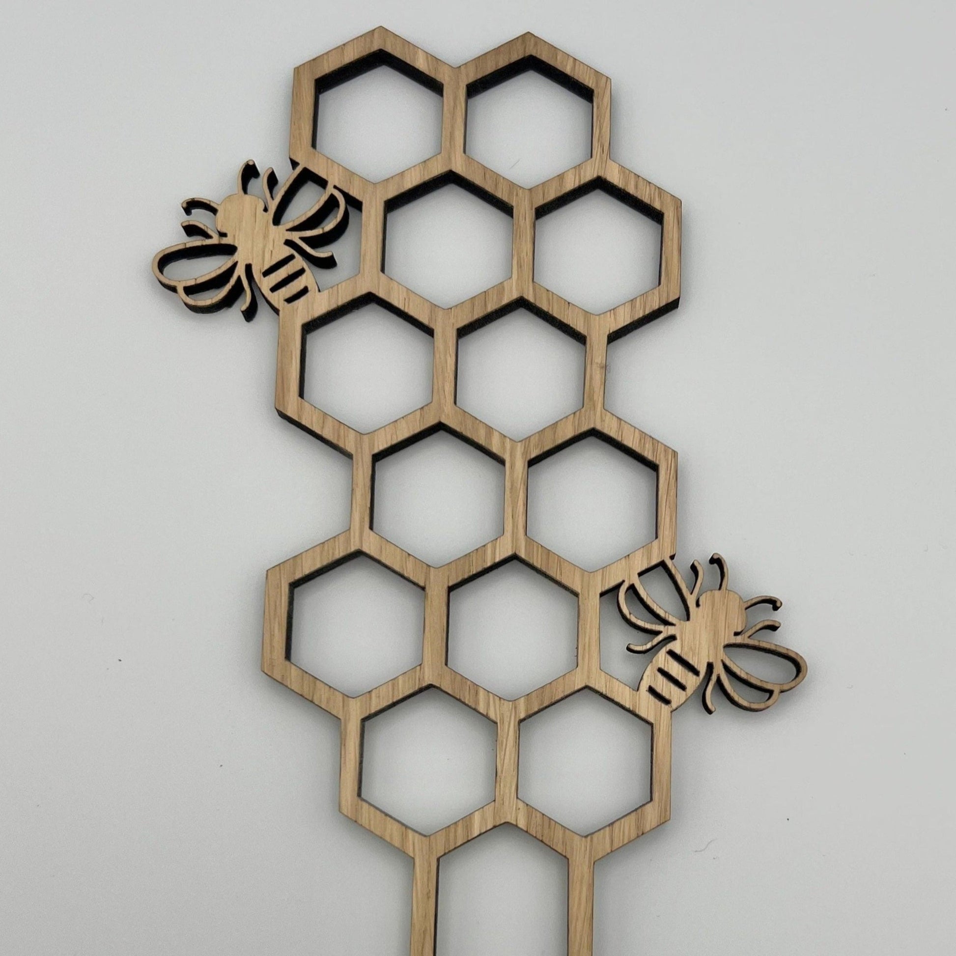 Handmade wooden plant trellis with bee design