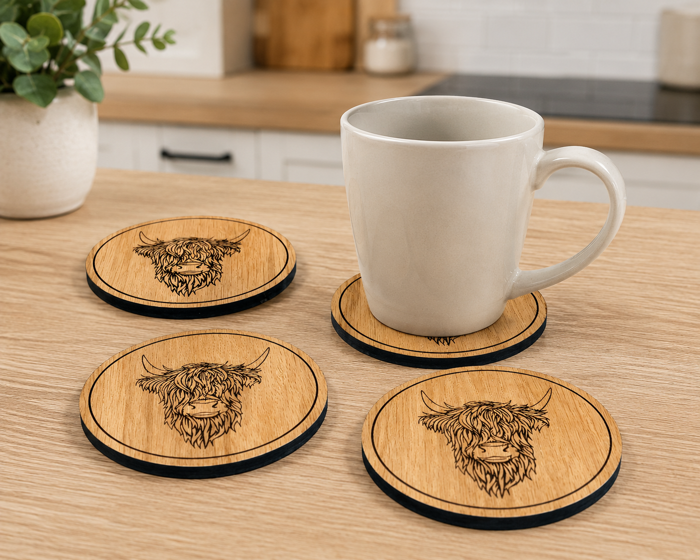 White mug on wooden coasters with highland cow design in a kitchen setting