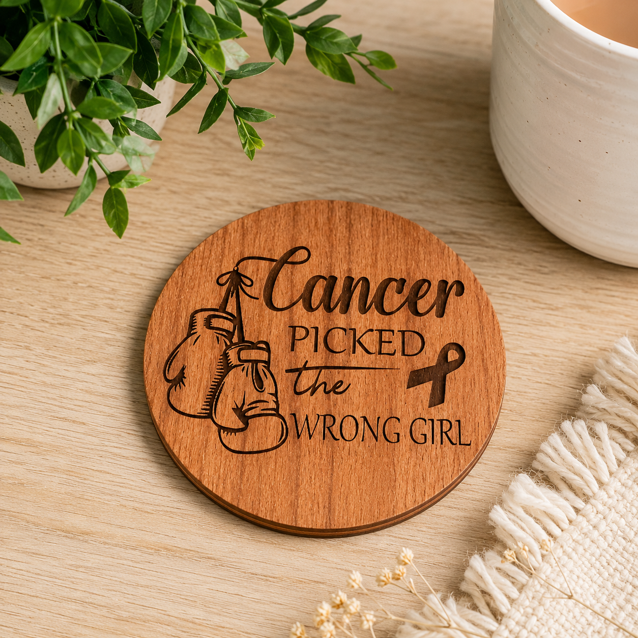 Inspirational cancer survivor coaster displayed in a warm home setting