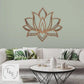 Wooden lotus wall art above a white sofa with decorative pillows in a living room setting.