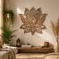 Decorative mandala lotus flower wall art in a living room with plants and a candle.