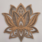 Wooden lotus flower wall art on a light gray background