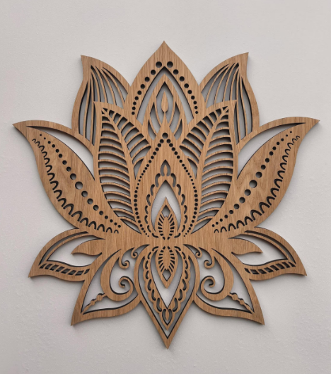 Wooden lotus flower wall art on a light gray background