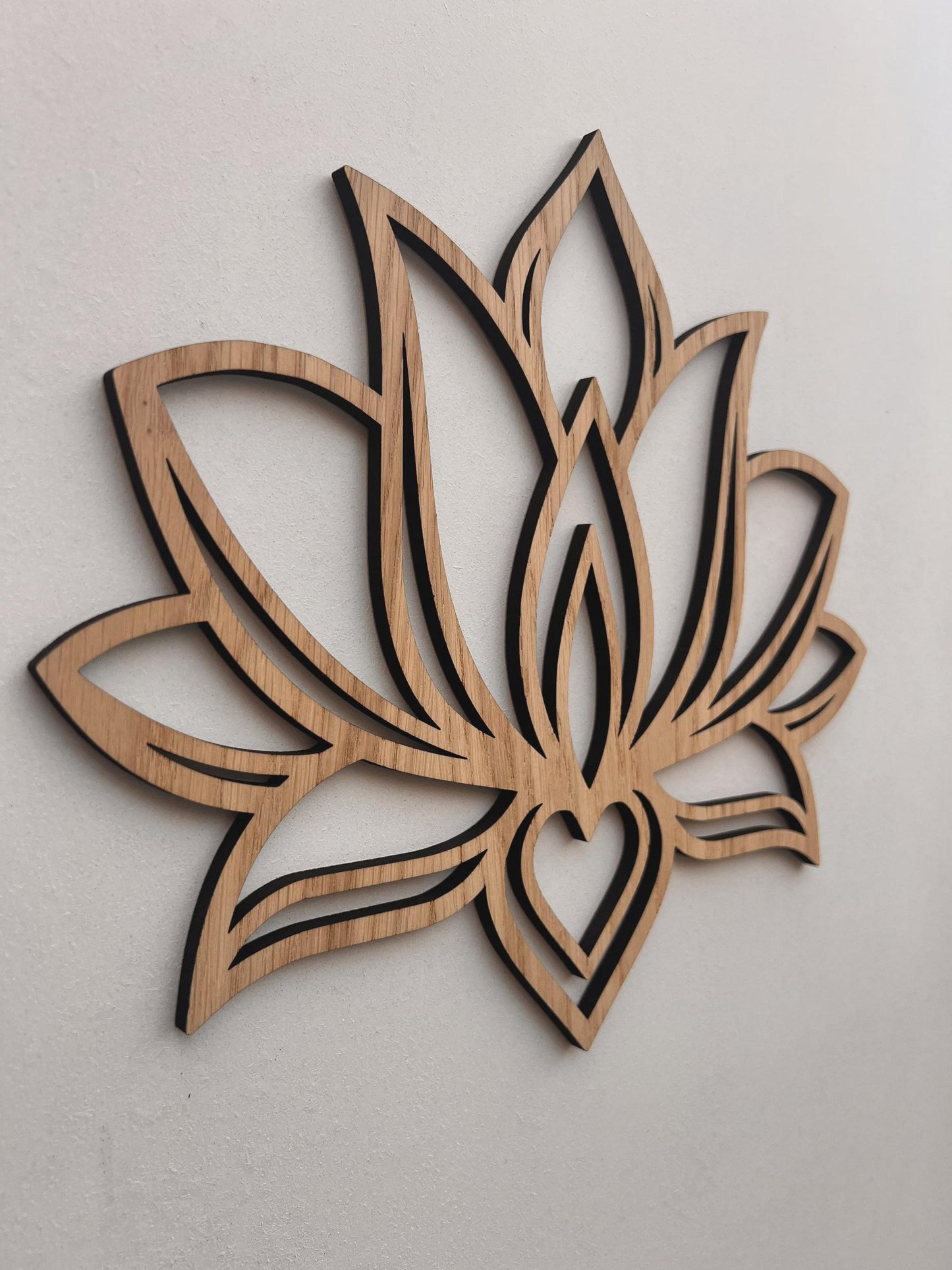 Laser cut lotus flower wooden wall décor on neutral wall
